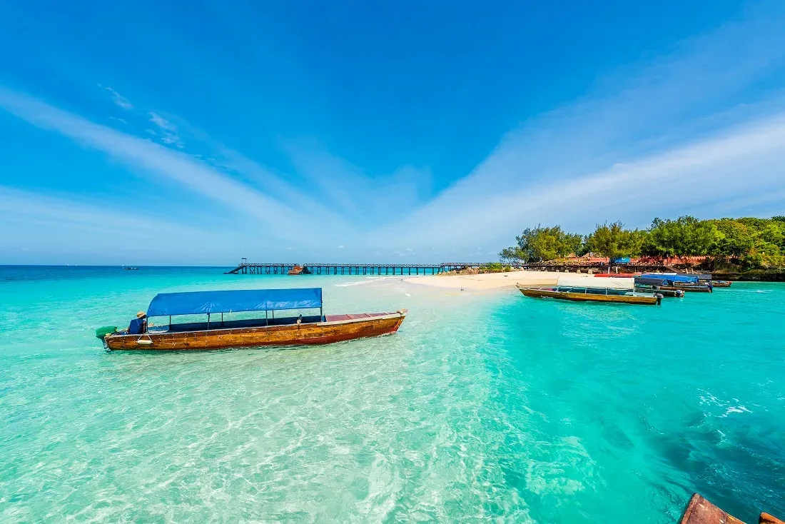 Turquoise water and a wooden jetty off Zanzibar